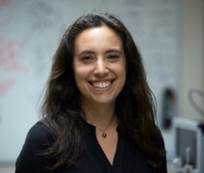 Medium shot of a person smiling

Description automatically generated