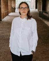 A person in a white shirt

Description automatically generated