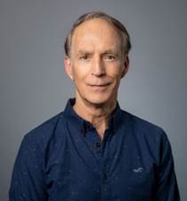 A person in a blue shirt

Description automatically generated