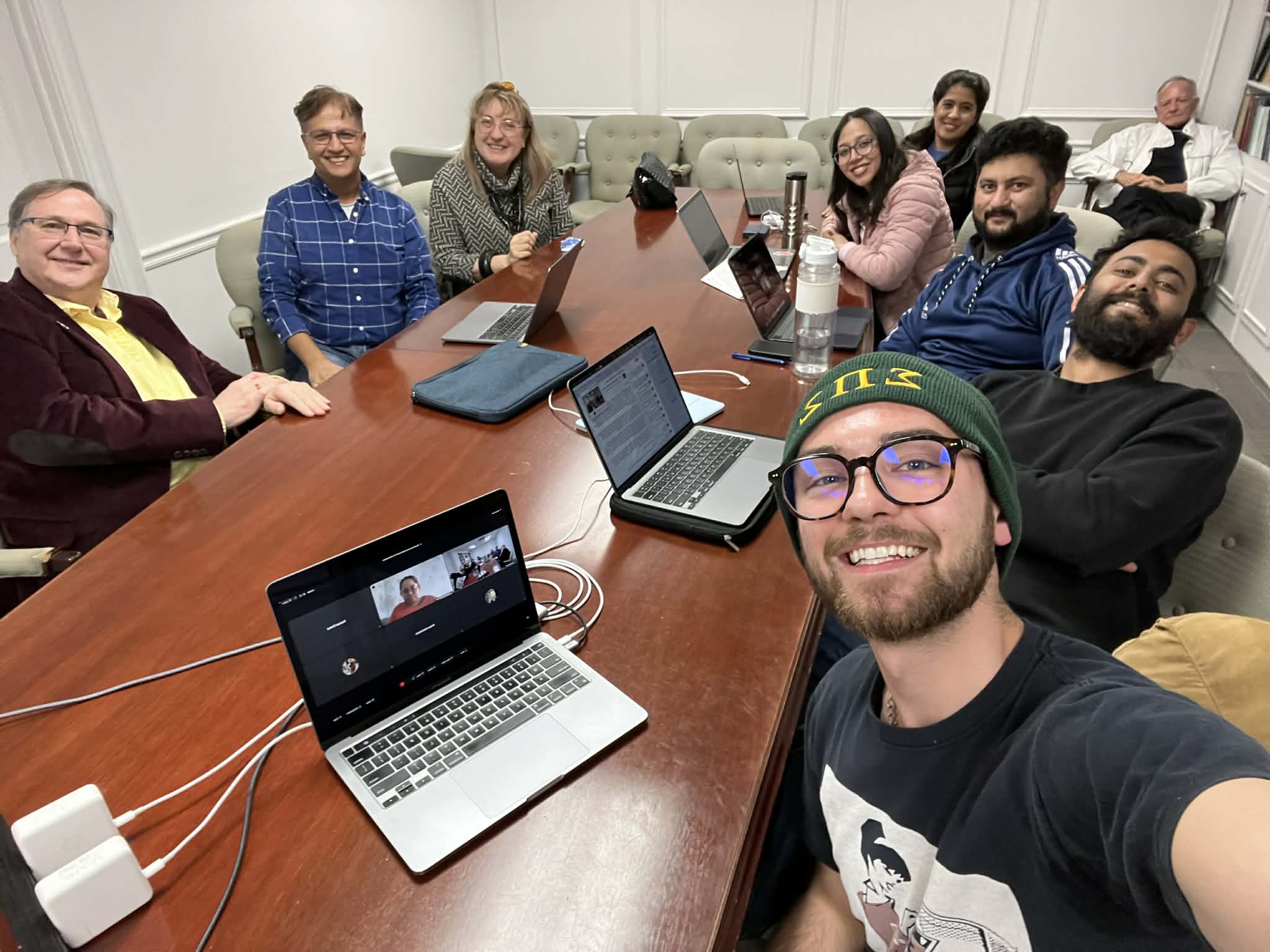 Dhamala Lab group meeting around a conference table