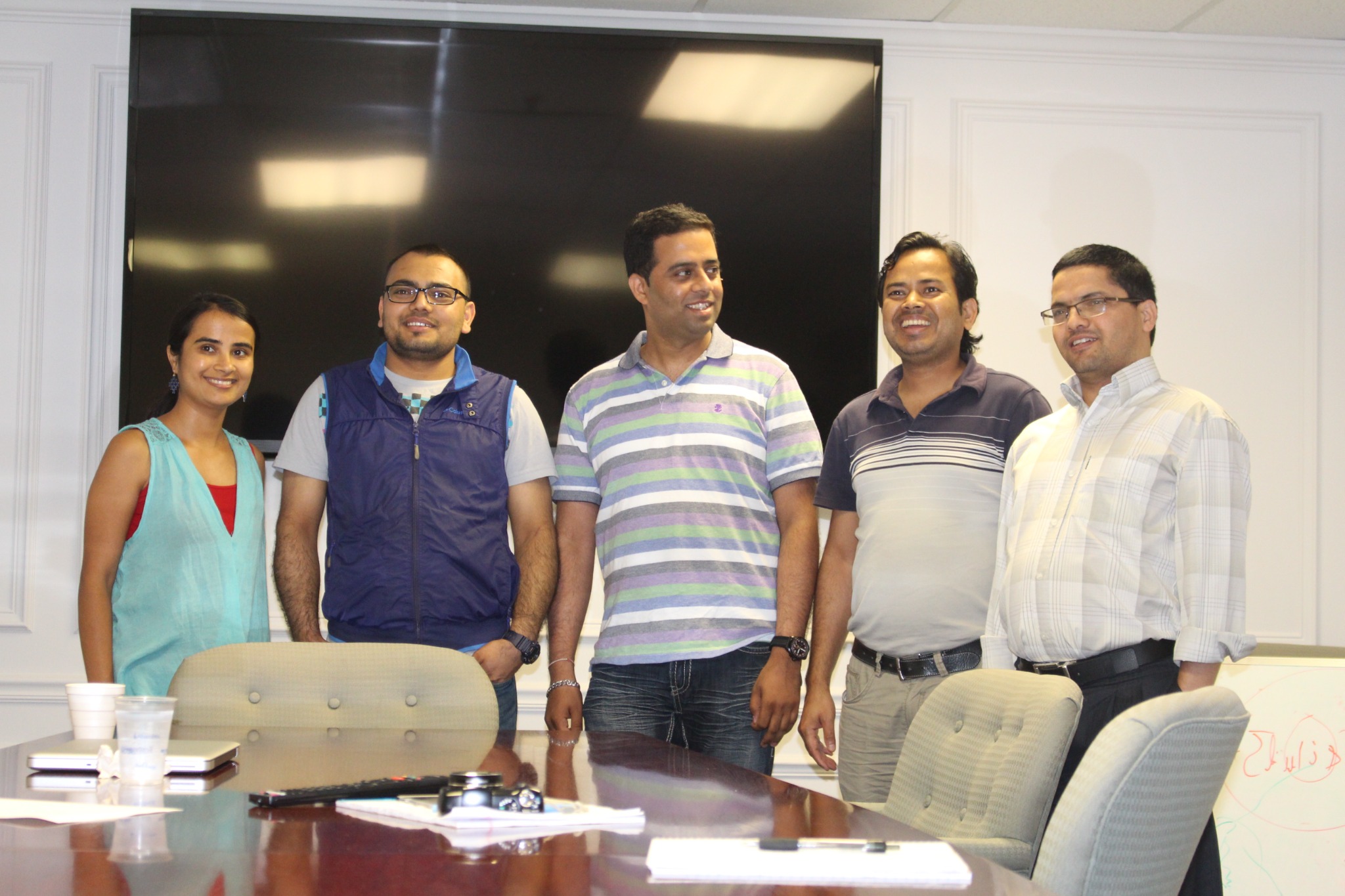 Earlier Dhamala Lab group photo in a meeting room