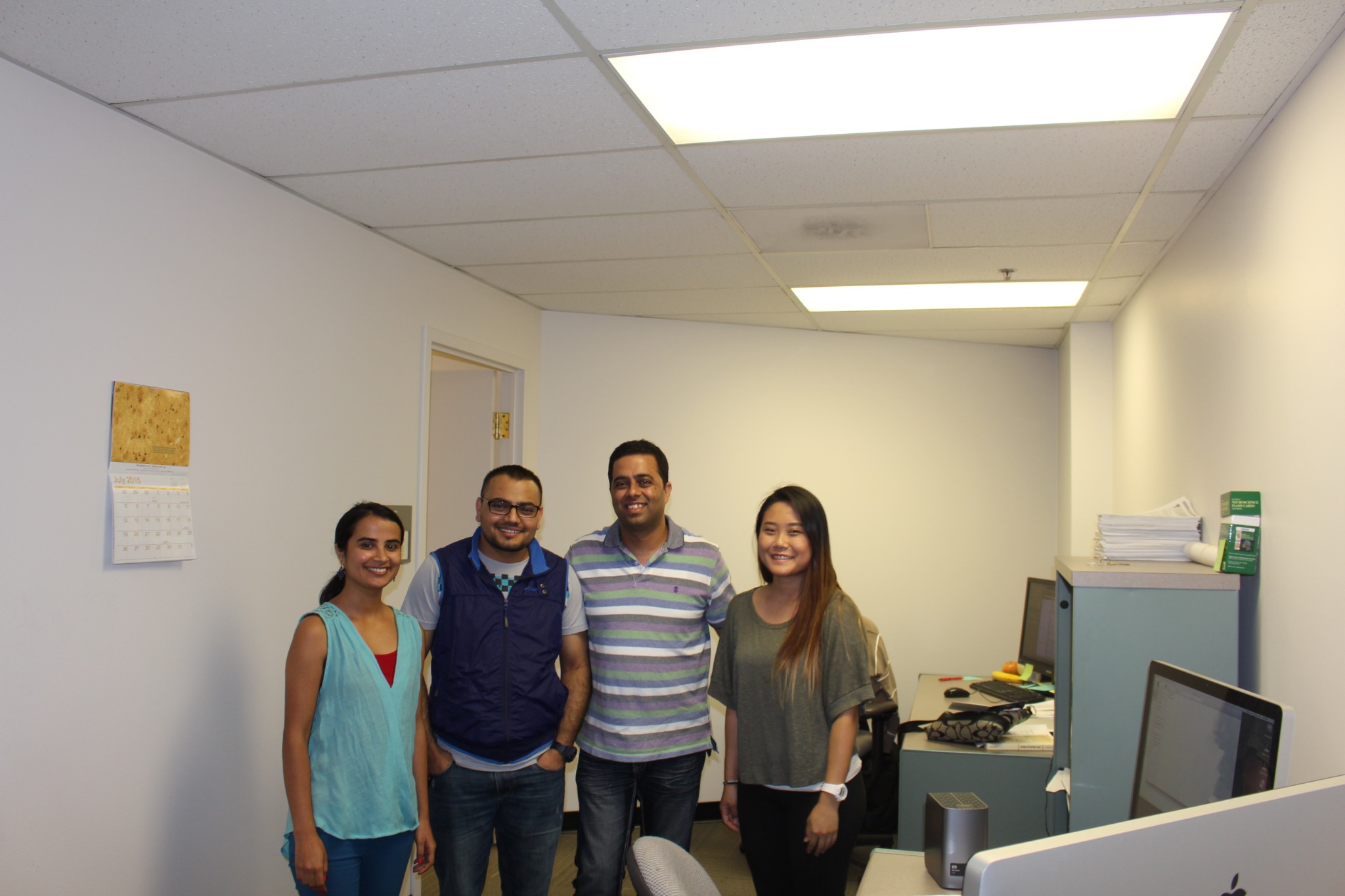Mukesh Dhamala with students in the lab office
